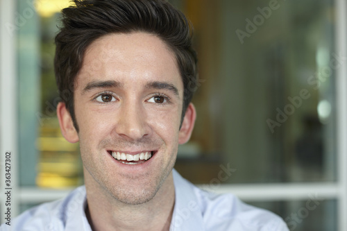 Businessman smiling while looking away