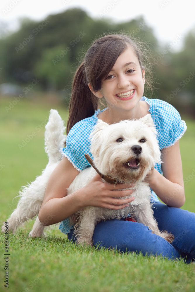 Girl holding pet dog Girl holding pet dog