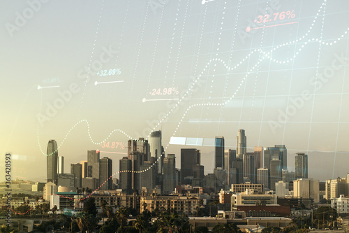 Abstract virtual stats data hologram on Los Angeles skyline background. Multiexposure