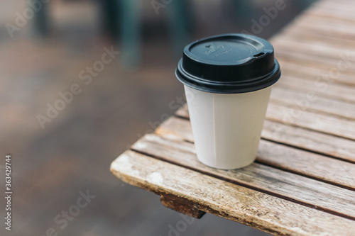 cup of take away coffee on the table