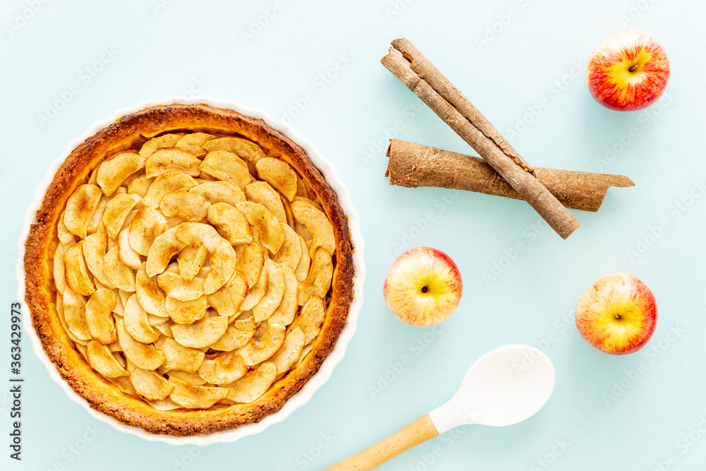 Homemade baked French apple tart, an open faced apple pie, in a baking