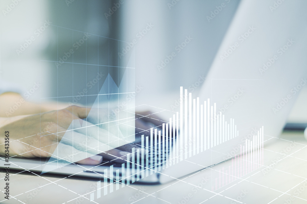 Multi exposure of abstract creative financial graph with hand typing on laptop on background, forex and investment concept Multi exposure of abstract creative financial graph with hand typing on laptop on background, forex and investment concept