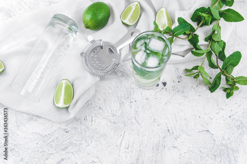 Composition with fresh mojito on white background