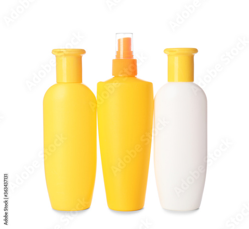 Bottles of sunscreen on white background