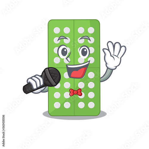 caricature character of medicine pills happy singing with a microphone