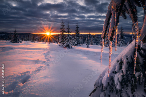Beautiful sunset during winter on top of mountains