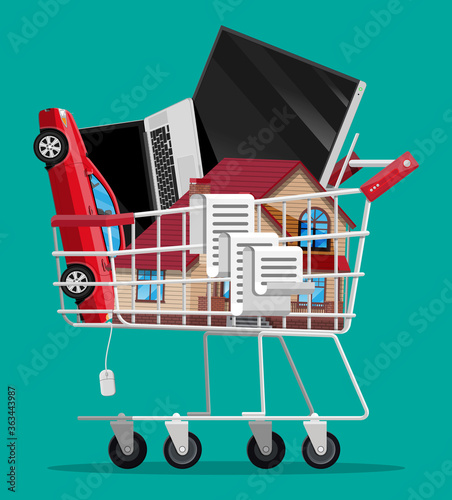 Full supermarket shopping cart isolated on green background. Metal shop trolley on wheels with house building, car, laptop, tv and receipt check. Vector illustration in flat style