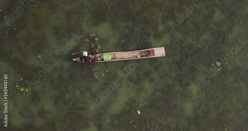 Fisherman Rowing His Wooden Fishing Boat In Loktak Lake In Moirang, Manipur, Northeast India. - Top View - Aerial drone photo