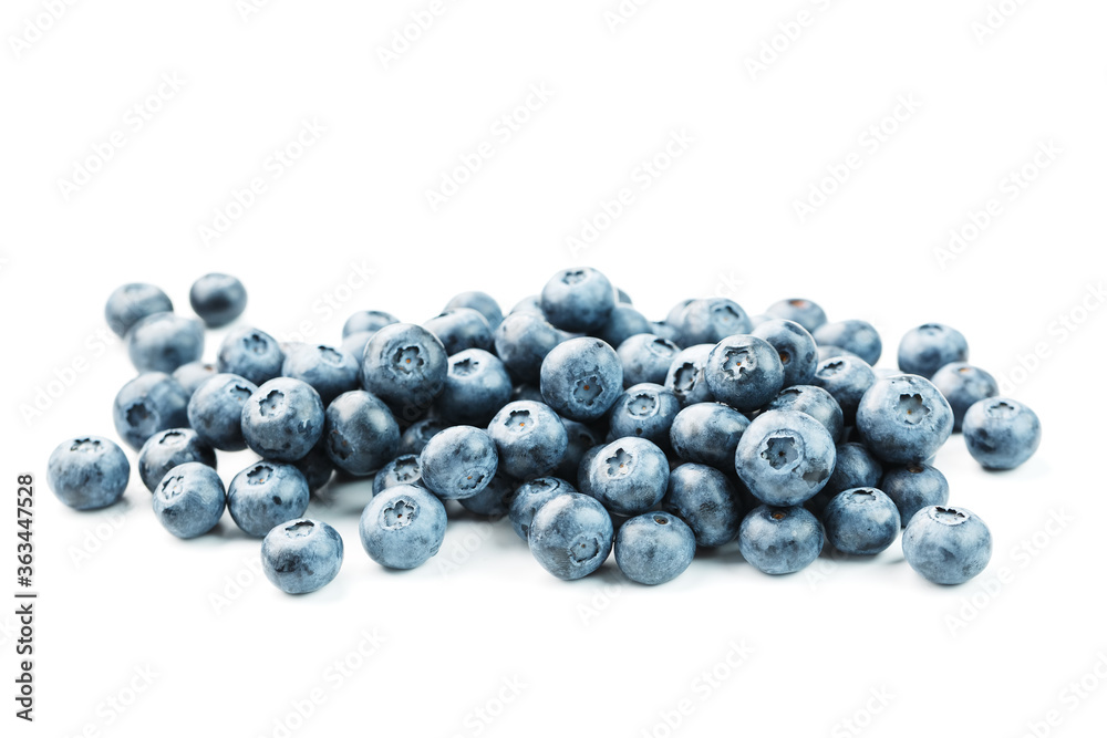 Tasty blueberries fruit are scattered on a white background.