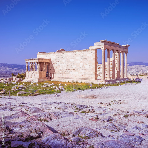 Acropolis of Athens Greece, Caryatids female statues on Erechtheion ancient temple under sunny blue sky