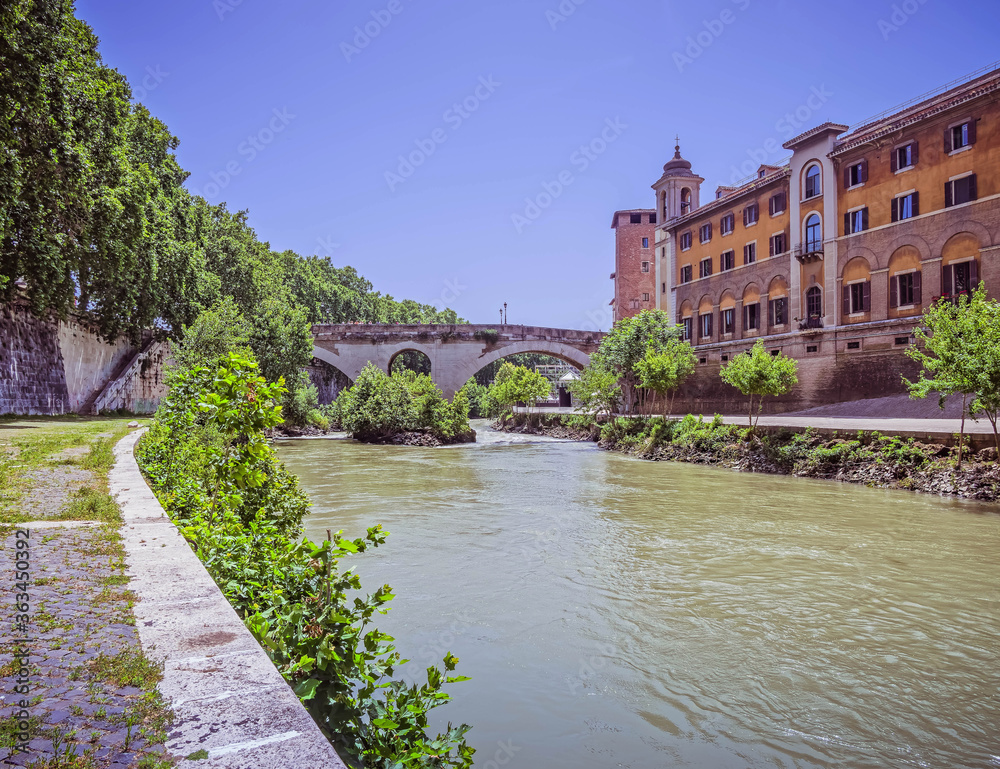 Fototapeta premium Rome Italy, Tiber island, bridge Fabricio and Caetani fortress tower view from lungotevere de Cenci