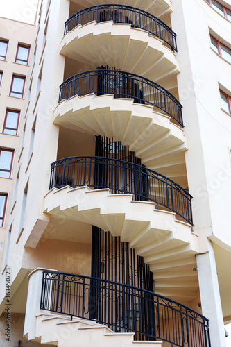 Spiral staircase on the outside facade of the house