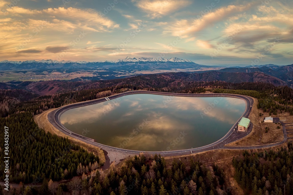 Naklejka premium pumped storage hydropower plant in sunset under High Tatras