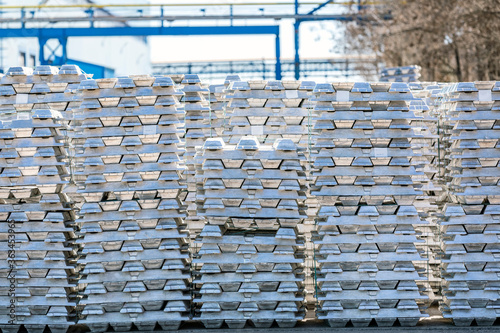 Aluminium ingots in outside field of factory. The Hall–Heroult process is the major industrial process for smelting aluminium. photo