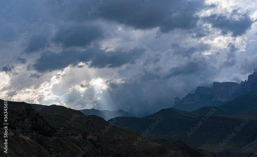 Sun rays make their way through the clouds