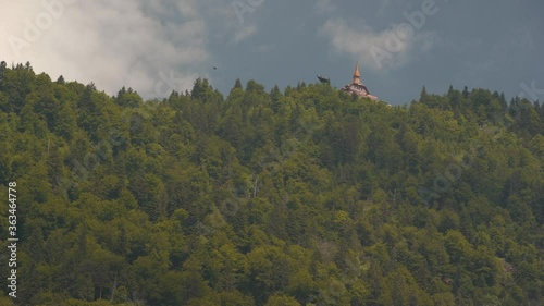Static shot of The Harderkulm, a viewpoint overlooking the towns of Interlaken and Unterseen in Swiss alps photo