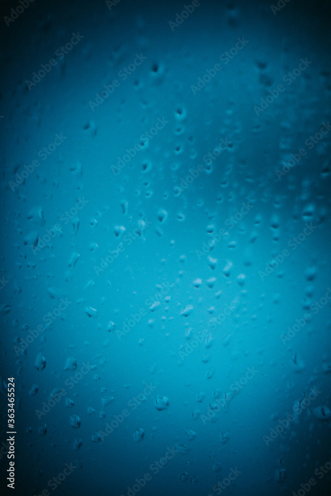 Raindrops on window glass,condensation on the window,natural background,color texture,blue abstract and pattern
Raindrops on window glass,condensation on the window,natural background,color texture,blue abstract and pattern