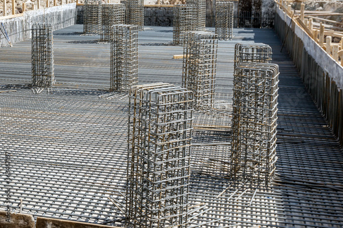 A tied rebar beam cage before casting concrete. This will be embedded inside cast concrete to increase its tensile strength. Rebar, known when massed as reinforcing steel or reinforcement steel.