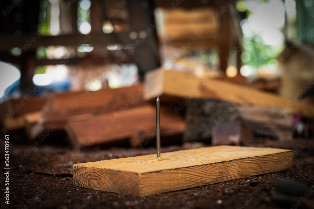 Nail steel on board wood In the construction area Nail steel on board wood In the construction area