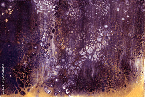 Very beautiful texture background. Purple paint flows in gold with the addition of white paint. Style includes curls of marble or agate with bubbles and cells. Natural style.