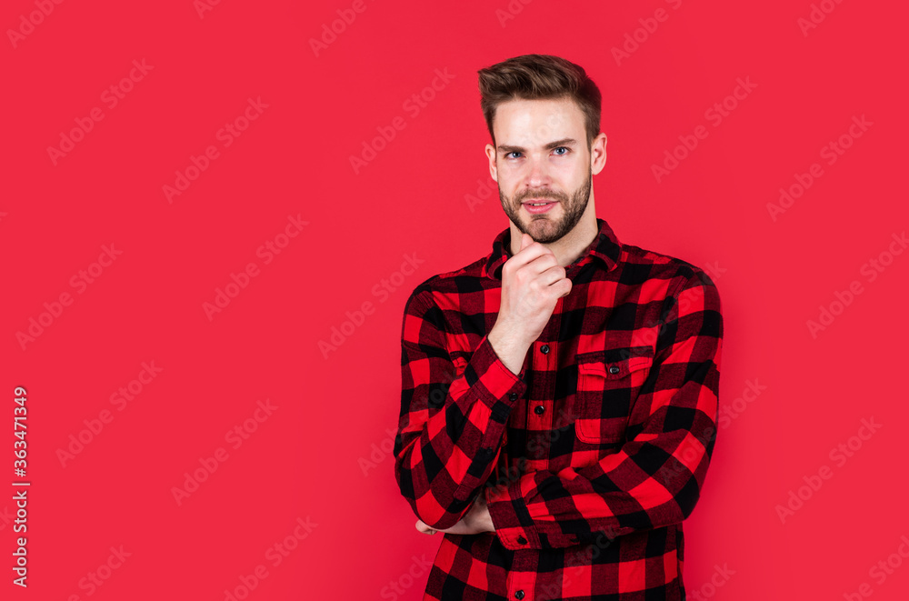 Obraz premium handsome man wear checkered shirt. unshaven guy in casual style. male hairdresser and barbershop. male beauty trend. bearded man with sexy bristle. facial hair and skin care. copy space