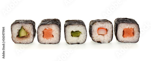 sushi rolls assortment in a row closed up isolated on white