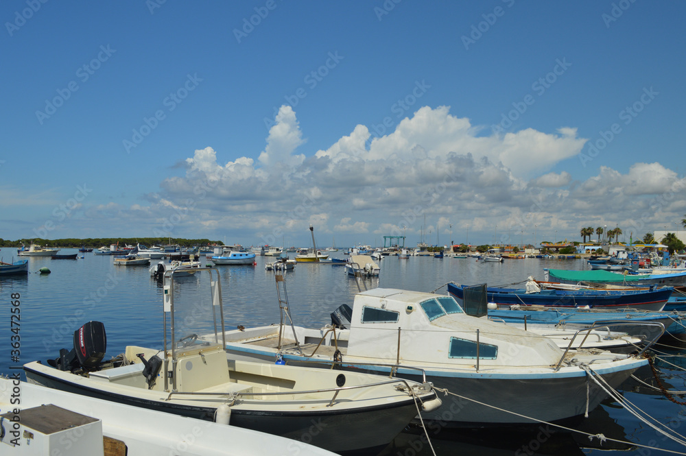 Fototapeta premium Boats in the small bay of Porto Cesareo, in the Puglia region.