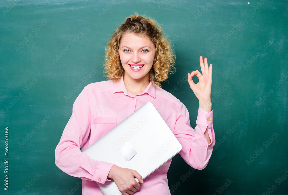 happy student with laptop. teacher woman at blackboard. IT Lesson with Computer. e-learning concept. modern technology. girl Study Online in Classroom. online education. freelancer work. ok gesture happy student with laptop. teacher woman at blackboard. IT Lesson with Computer. e-learning concept. modern technology. girl Study Online in Classroom. online education. freelancer work. ok gesture