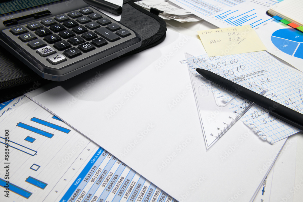 business office desk closeup - financial reports, analysis and accounting, set of documents, tables and graphs, various items for bookkeeping, calculator business office desk closeup - financial reports, analysis and accounting, set of documents, tables and graphs, various items for bookkeeping, calculator