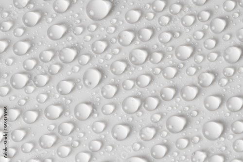 Water drops on gray background. Top view. Closeup.