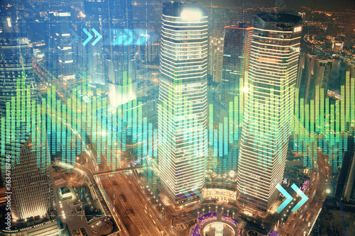Photography Financial chart on city scape with tall buildings background multi exposure