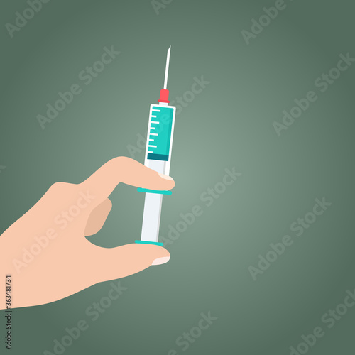 Hand is hold Syringe, In the hand held syringe Vaccines for the treatment or prevention of diseases Covid-19, corona virus Concept.