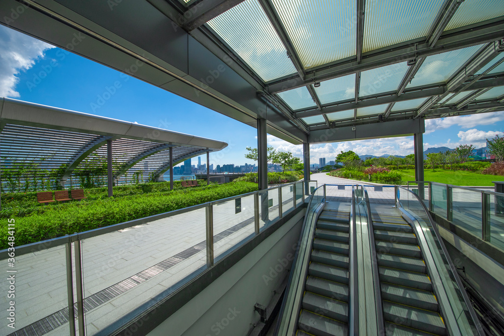 Modern glass elevator and pedestrian stairway entrances. Modern glass elevator and pedestrian stairway entrances.