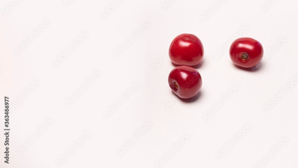 red ripe cherry on a white background. Macro cherry, space for text. Recipe blank red ripe cherry on a white background. Macro cherry, space for text. Recipe blank