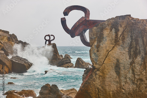 Donostia coastline landmark rock formations. Peine del viento. Spain photo