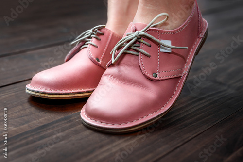Pink ladies leather shoes isolated close-up