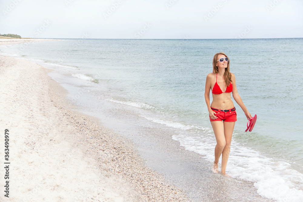 Resting woman is walking and enjoying at the beach. Resting woman is walking and enjoying at the beach.