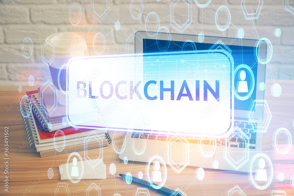 Multi exposure of blockchain theme hologram and table with computer background. Concept of bitcoin crypto currency. Multi exposure of blockchain theme hologram and table with computer background. Concept of bitcoin crypto currency.