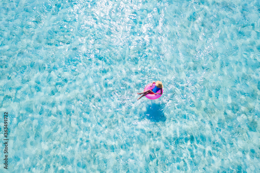 Top above high angle aerial drone view of her she slim fit attractive girl floating on rubber ring in pure sea water dream tour enjoy joy sunny day peaceful activity leisure spend summertime season