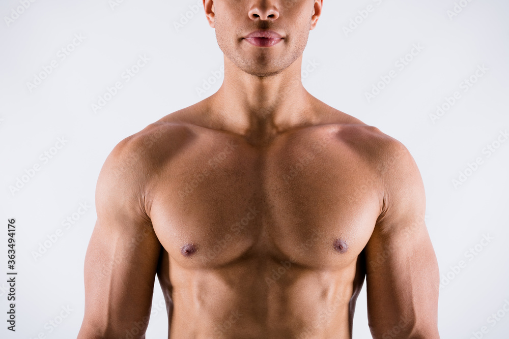 Fototapeta premium Closeup cropped photo of handsome serious concentrated muscular sportsman dark skin guy demonstrating his perfect ideal body constitution naked chest isolated white color background