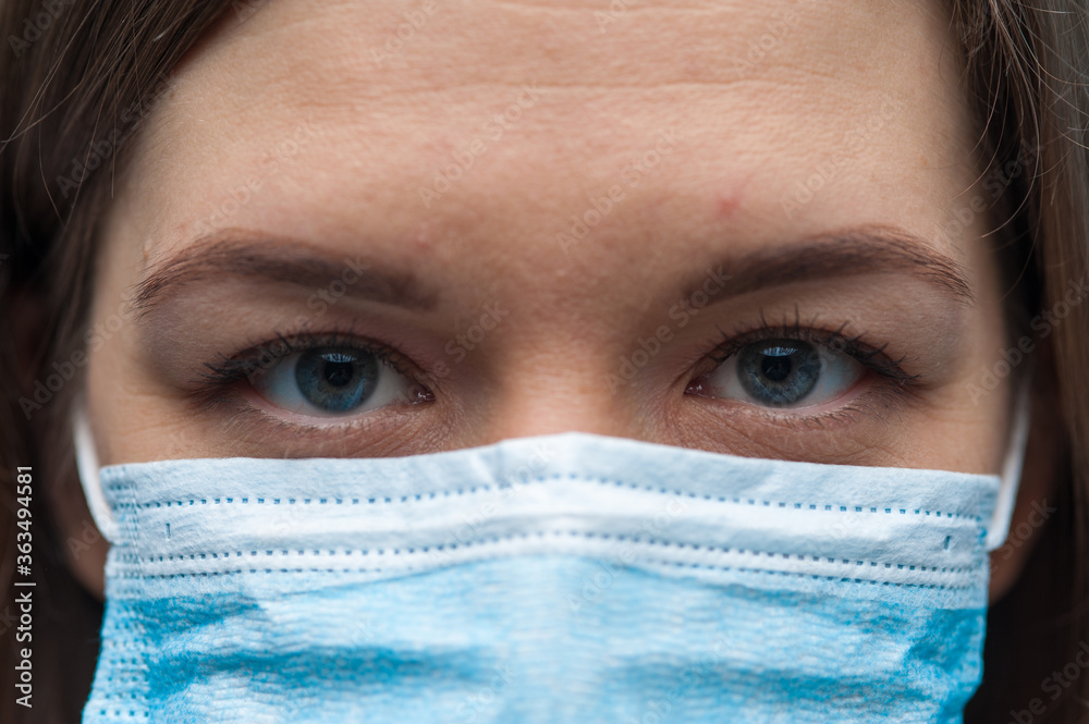 Woman wearing an anti virus protection mask to prevent corona virus Woman wearing an anti virus protection mask to prevent corona virus
