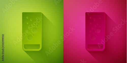 Paper cut Effervescent aspirin tablets dissolve in a glass of water icon isolated on green and pink background. Paper art style. Vector Illustration.