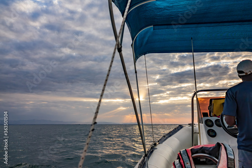 Fototapeta Naklejka Na Ścianę i Meble -  Iconic sunset over boat at lake Malawi