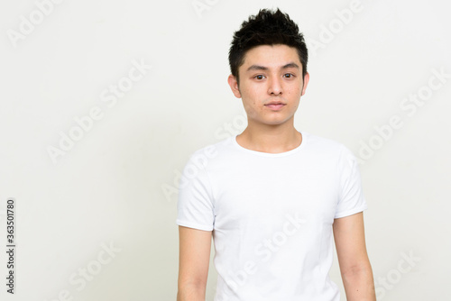 Portrait of young handsome Asian man looking at camera © Ranta Images
