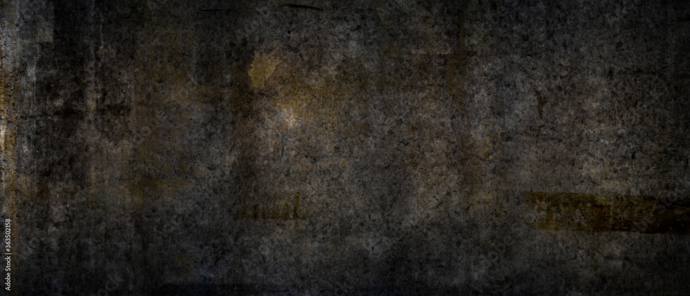 Texture of a grungy black cement wall as background