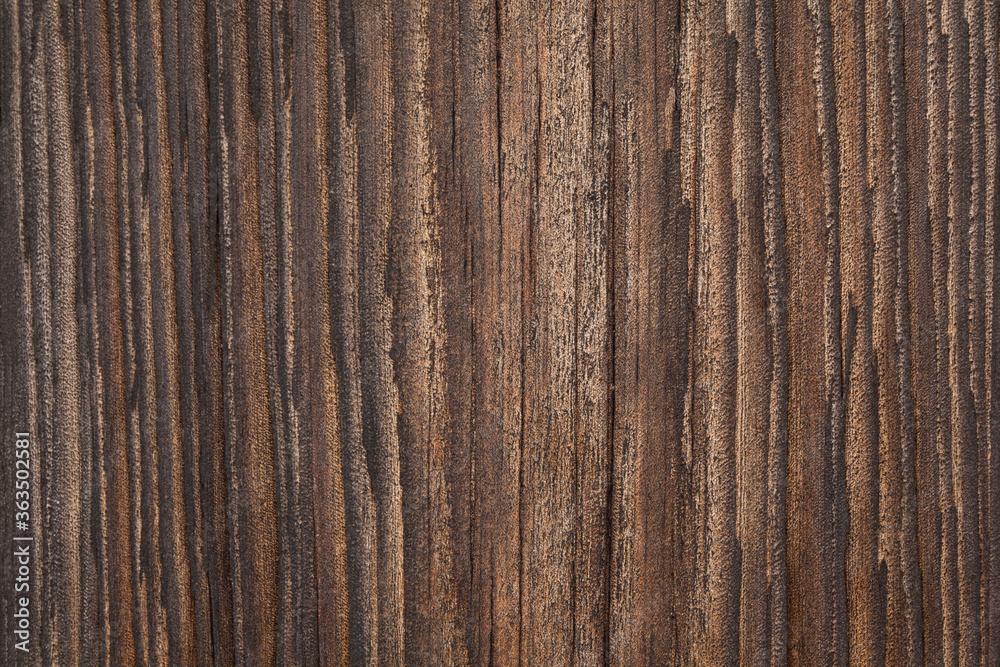 Obraz premium Zbliżenie na starą spękaną deskę.