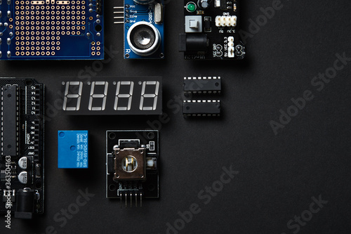 Overhead Flat Lay Shot Of Electronic Computer Components On Black Background photo