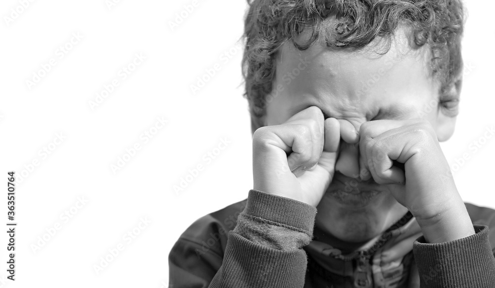 boy crying in poverty with no help crying alone and all by himself on white background stock photo boy crying in poverty with no help crying alone and all by himself on white background stock photo