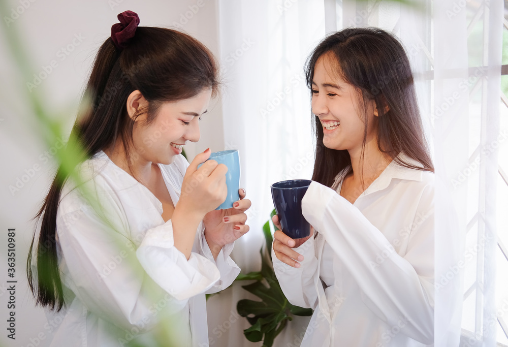 Cropped shot view beautiful young asian women LGBT lesbian Portrait of a beautiful woman drinking coffee and having a good time with her friends. Cropped shot view beautiful young asian women LGBT lesbian Portrait of a beautiful woman drinking coffee and having a good time with her friends.