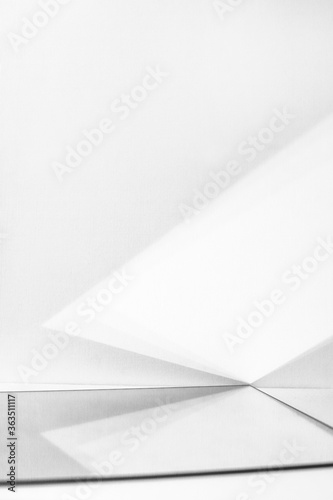 minimalistic white geometric background of shadows and reflections